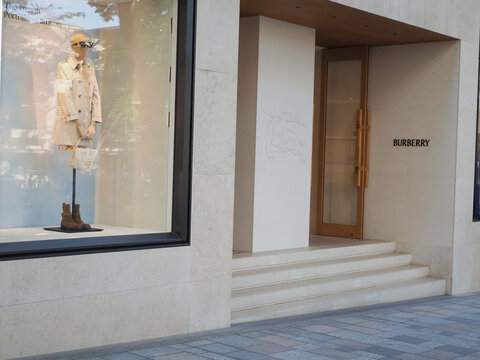 TOKYO, JAPAN - April 12, 2026: Front of a Burberry store with window display featuring a trench coat. The shop is in Tokyo's Omotesando area.