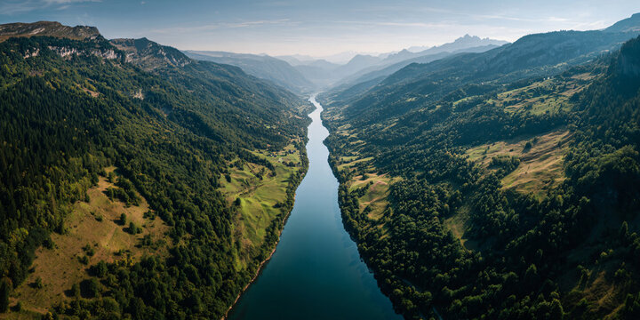 Symmetrical Alpine Valley with Straight River Running Through