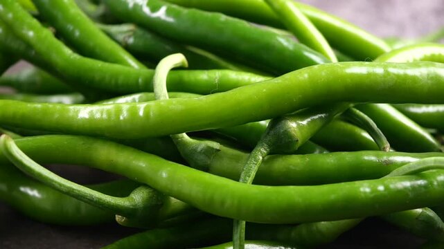 Cooking green chili peppers for a tasty dish