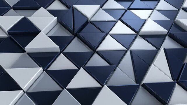 Abstract three-dimensional triangle tile pattern with shiny reflective surfaces creating a modern design.
