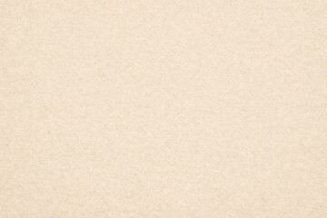 Fototapeta premium Beige paper texture with subtle grain, a neutral background.