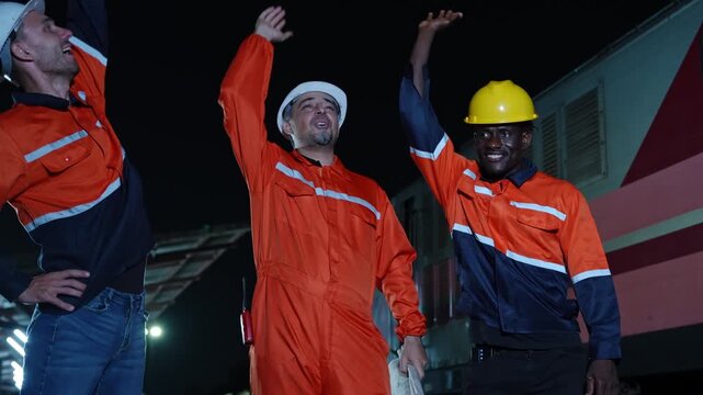 Group of construction professionals working together during a night shift equipped with safety gear and essential tools