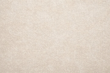 Fototapeta premium Textured wall surface, coarse plaster finish with neutral tones