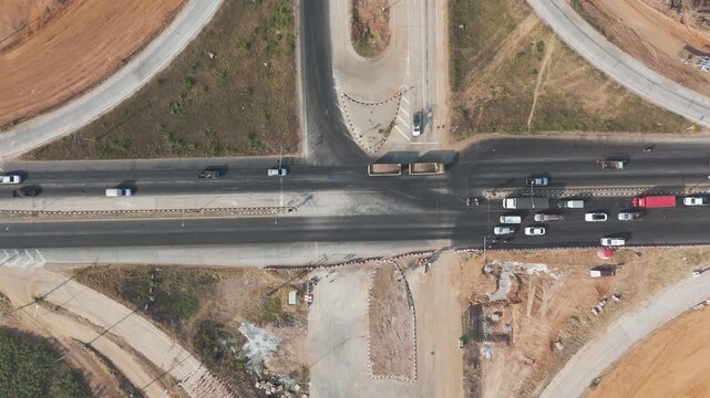 Slow motion drone footage aerial view scenic landscape of the traffic in the rural place highway