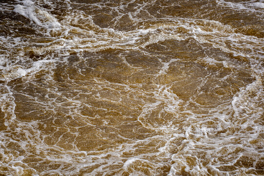 Close up of turbulent river water surface.