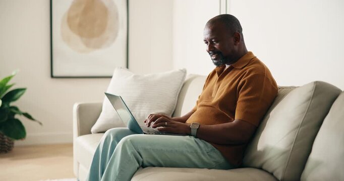 Man, typing and remote work in home with laptop, email or marketing manager smile for digital campaign. Mature, black person or freelancer in house with computer, editing creative project or proposal