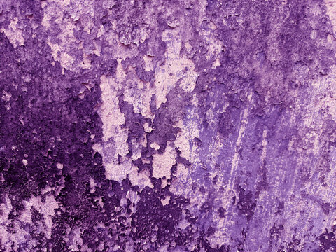 A close-up shot captures the rough, weathered texture of an old concrete wall. The surface is uneven, dark patches, mineral stains, and reflecting natural aging