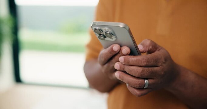 Man, hands and typing with phone in home for network connection, social media or communication. Male person, texting or chatting with mobile smartphone for online app, browsing or internet service