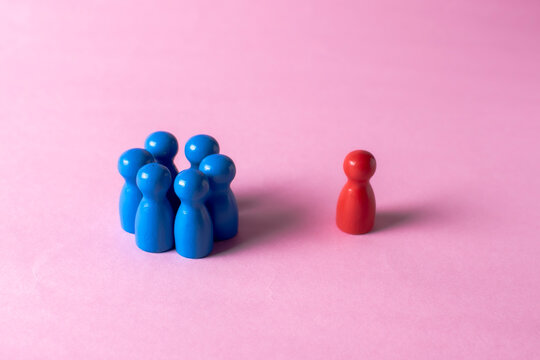 Group excluding one individual symbolizing discrimination, rejection and social isolation