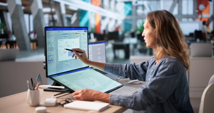Mature Marketing Manager Uses Touchscreen