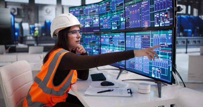 Skilled Female Engineer Monitors Gas Flow Systems