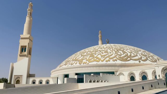 Majestic ornate archway with hanging lantern inside Sheikh Khalifa Bin Zayed Grand Mosque, Al Ain, Abu Dhabi.
