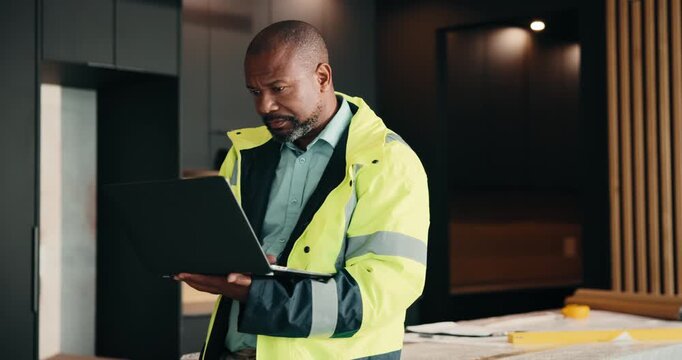 Design, laptop and renovation with black man in kitchen for home improvement or upgrade project. Computer, real estate and search with mature construction worker in apartment for property update