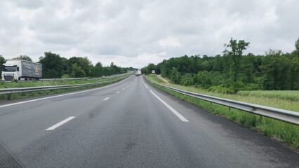 Fototapeta premium POV View of a Multi-Lane Highway Through the French Countryside