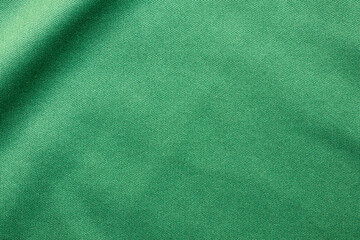 Fototapeta premium Green sports clothing fabric football shirt jersey texture close up
