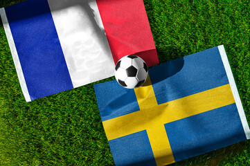 Fototapeta premium France vs Sweden, national flags before international football tournament Round of 32 match, football on green grass with goal in the background, East Rutherford, New Jersey, USA, June 30, 2026