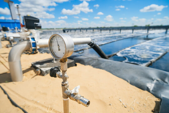 Sewage treatment plants or wastewater treatment systems, on a sunny summer day.