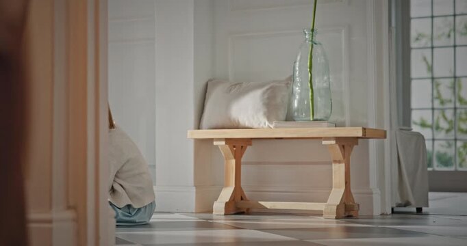 Legs, dad and child with attachment in home for separation anxiety, dependence or sad for leaving. Clingy behavior, father and dragging girl for emotional connection, attention and struggle to walk