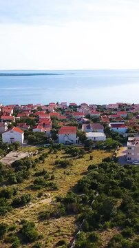 Ascending over apartma village Mandre on Pag island 