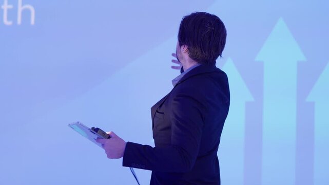 Engaging business presentation featuring a speaker actively interacting with the audience in a professional environment