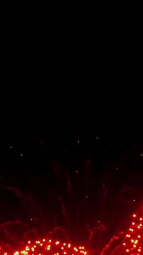 Shimmering lights blossom into golden fountains, painting the midnight sky with radiant energy on New Year's Eve. A sparkling celebration unfolds against the inky darkness.