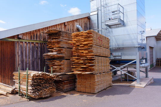 Timber Planks Stacked Outside Industrial Wood Factory in Germany