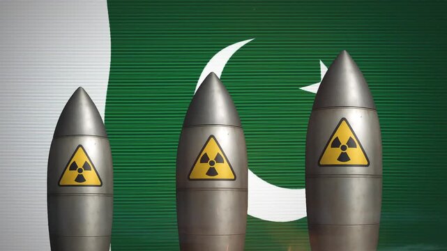 Nuclear missiles with radiation symbols displayed in front of the Pakistan flag motion video