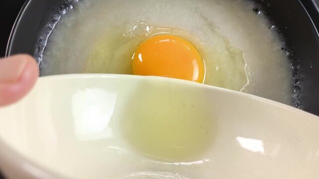 Closeup Pork congee with egg, ubdoor Chiangmai Thailand.