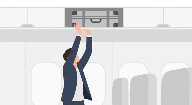Person Storing Luggage in Airplane Overhead Bin