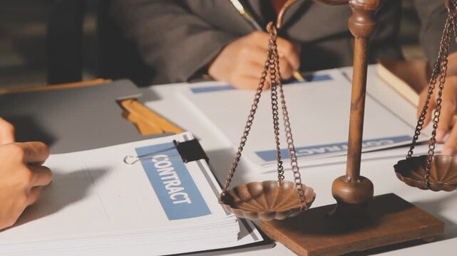 Lawyer explained to the client about the law that must be brought against the court case.Lawyer explained to the client about the law that must be brought against the court case.