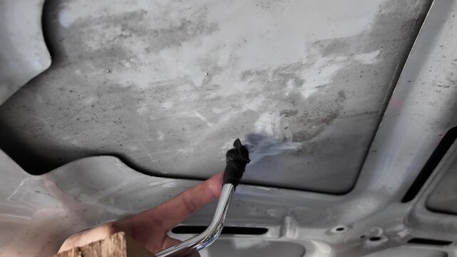 Removing dents on the car. PDR technology. Car body repair without painting.