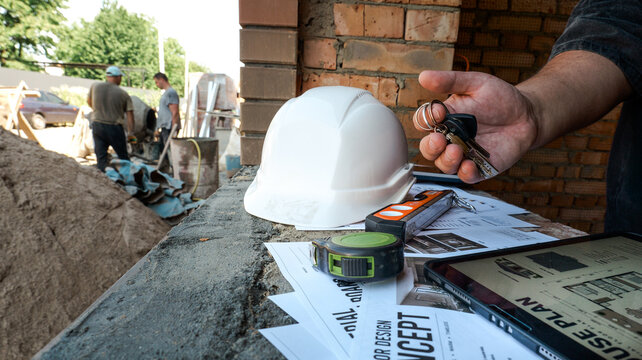 Construction site with tools and blueprints, ready for project management