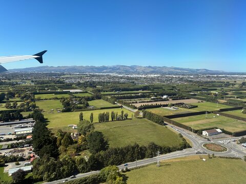 Aerial view of rural landscape before landing in New Zealand South Island