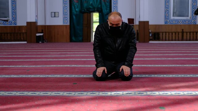Masked Man Prostrating
