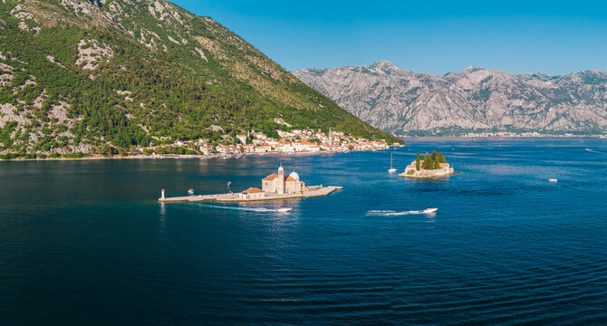 Aerial view of Our Lady of the Rocks island and Perast town in Bay of Kotor Montenegro