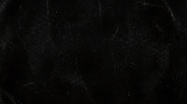 Dark scratched black background with white specks and scratches texture