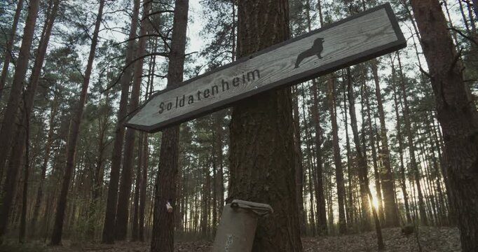 Sign From Second World War. Soldatenheim Is Soldiers Resting Place. German Wermacht Army Regulations. Reenactment Tactic Game. Autumn Season With Sunset Sky. Reenactor Dressed As German Soldier