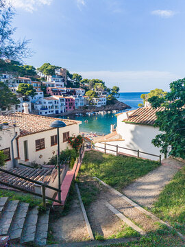 Scenic view of Sa Tuna Beach in Begur, Costa Brava, featuring turquoise waters, rocky shoreline and Mediterranean landscape. Popular travel destination in Catalonia, Spain.
