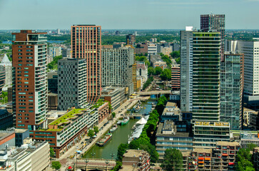 Obraz premium Rotterdam, The Netherlands, June 20, 2026: aerial view of the Wijnhaven/Wine Harbour in the historic Water Town, which has been transformed in a lively modern neighbourhood in recent decades