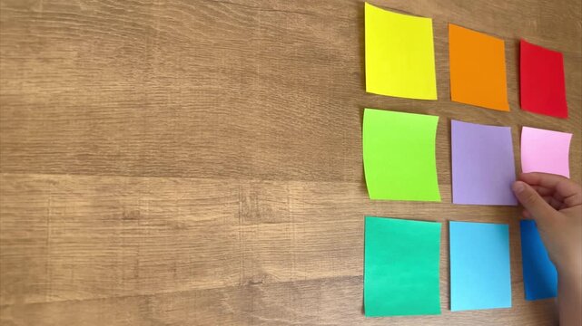 Child Hand Places the Ninth Origami Square to Complete a 3x3 Color Grid, 4K