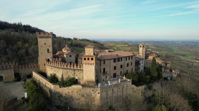 Drone view footage of Vigoleno Castle and medieval village in Vigoleno, Italy. Historic fortified hilltop destination in Emilia Romagna, ideal for tourism, travel, lifestyle and cultural vacation 