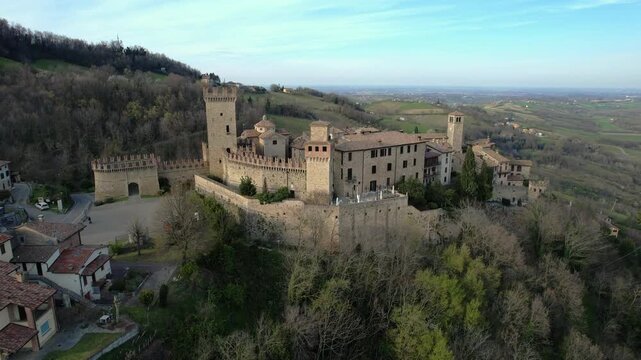 Drone view footage of Vigoleno Castle and medieval village in Vigoleno, Italy. Historic fortified hilltop destination in Emilia Romagna, ideal for tourism, travel, lifestyle and cultural vacation 