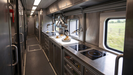 Fototapeta premium Luxury Train Galley with Robotic Culinary Equipment, Precision Plating and Automated Fine-Dining Meal Service