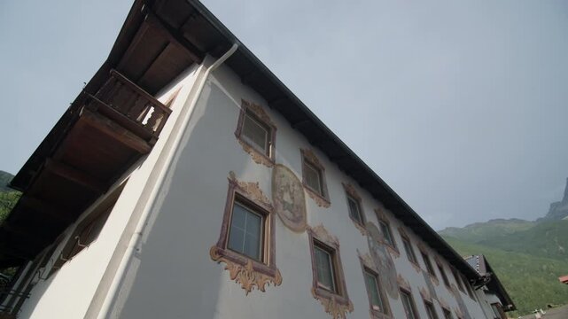 Architecture of alpine villages in the Oetz Valley, Tyrol, Austria. Beautiful historic mountain houses in the commune of Umhausen, travel and tourism in mountain Europe.