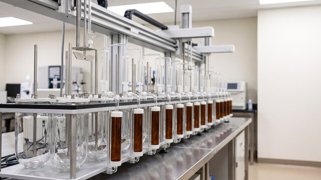 Automated Tablet Dissolution Testing System in Pharmaceutical Research Laboratory, Synchronized Sampling Apparatus and Quality Control Analysis