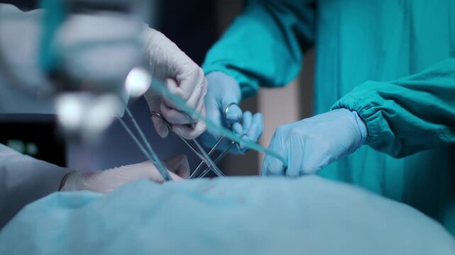 surgeon working in operating room with equipment