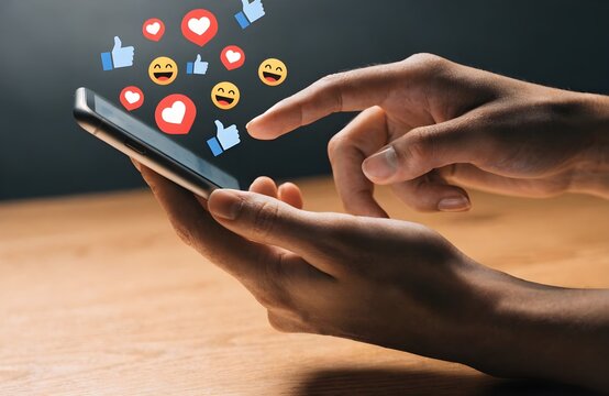 Social Media Engagement on Smartphone &ndash; Likes, Hearts, Emoji Reactions, Mobile App Interaction, Digital Communication Concept