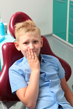 Child has toothache and is afraid. Little boy experiences fear at dentist appointment. Childish fear. Fear of dentist.