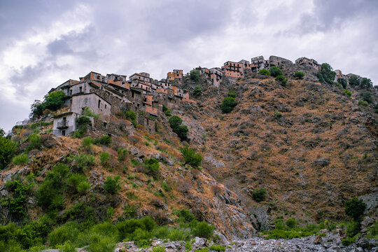Ghost town ruins of Roghudi Vecchio on a steep mountain ridge in Calabria