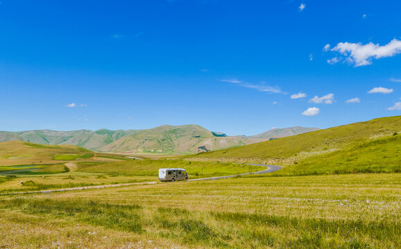 Motor home o camper van at beautiful panoramic road. Travel adventure vacation. 